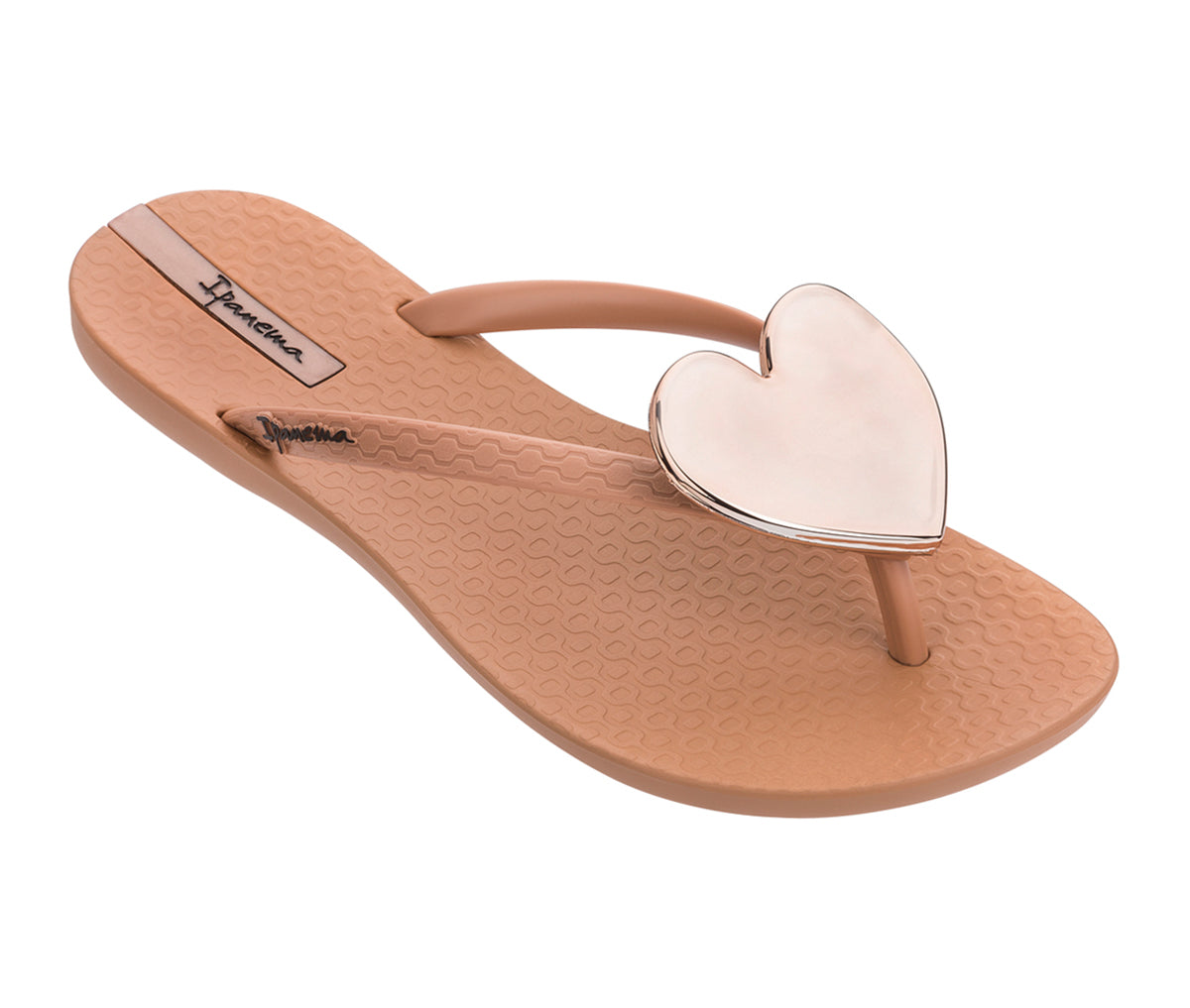 Angled view of a brown Ipanema Wave Heart flip flops with a gold heart.