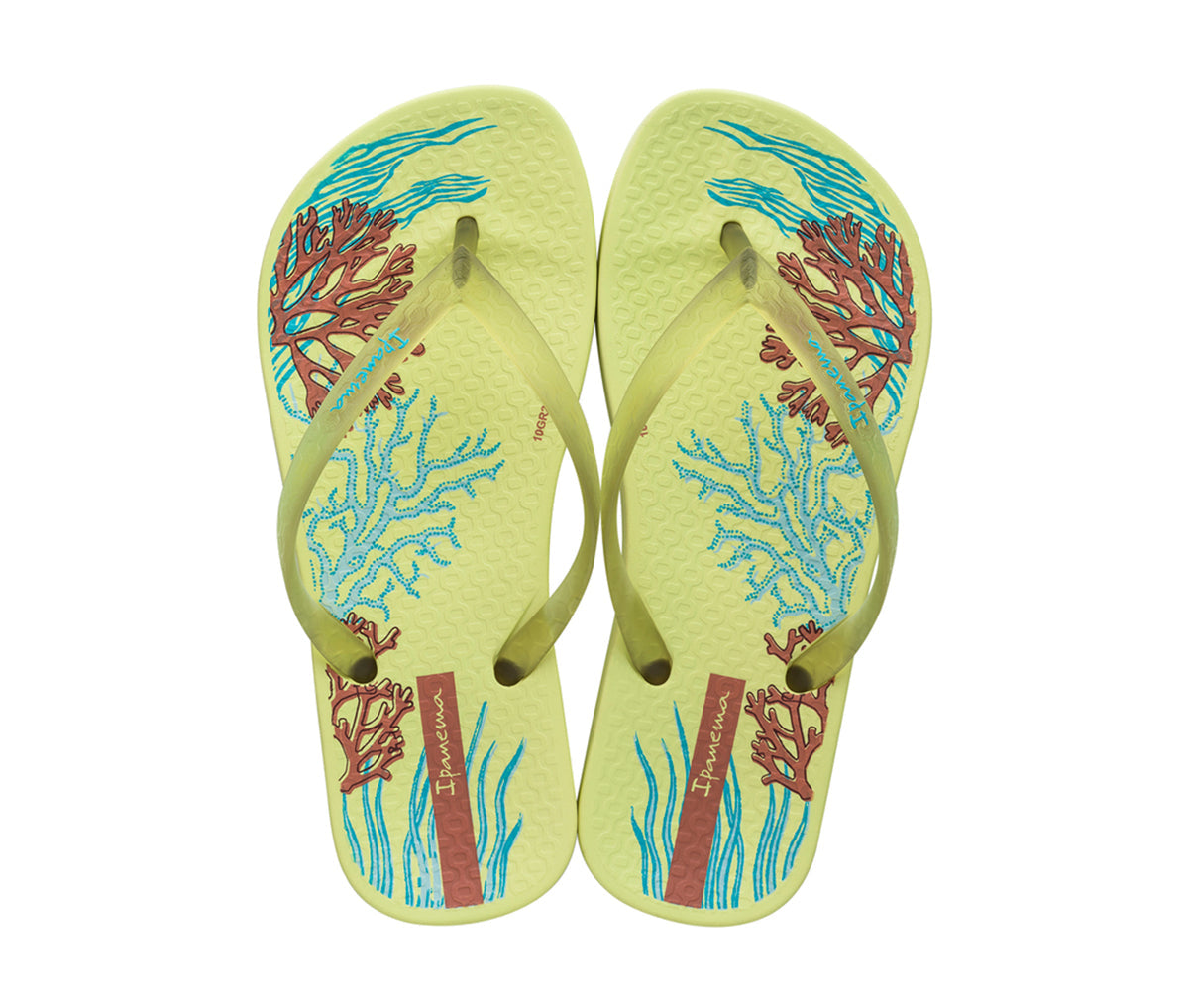 Top view of a pair of yellow Ipanema Ana Glossy flip flop kids with an under the sea print on the footbed.