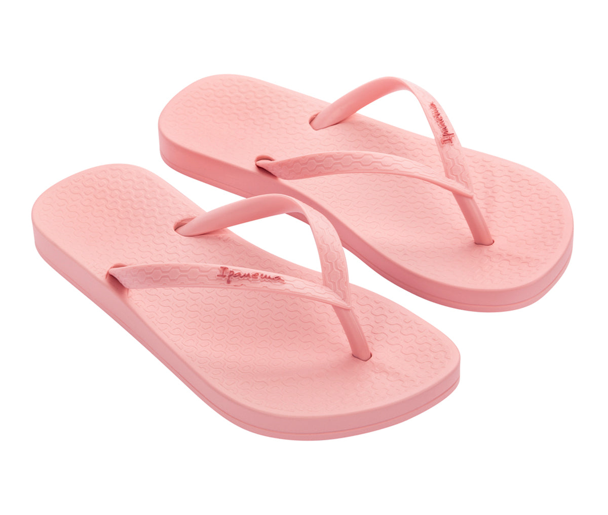 Angled view of a pair of pink Ipanema Ana Colors kids flip flops.