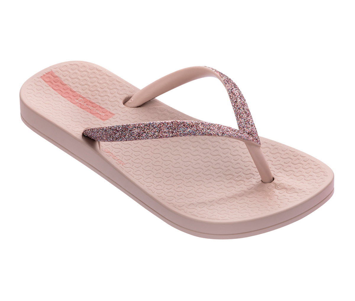 Angled view of a pink Ipanema Ana sparkle kids flip flop with a glitter strap.