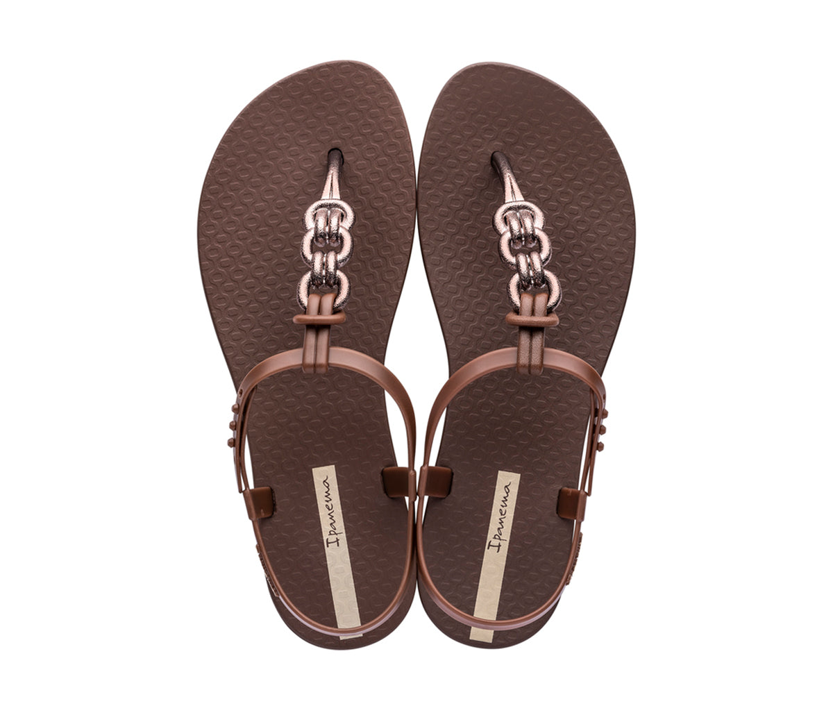 Top view of a pair of brown Ipanema Connect sandals with a bronze chain inspired t-strap.