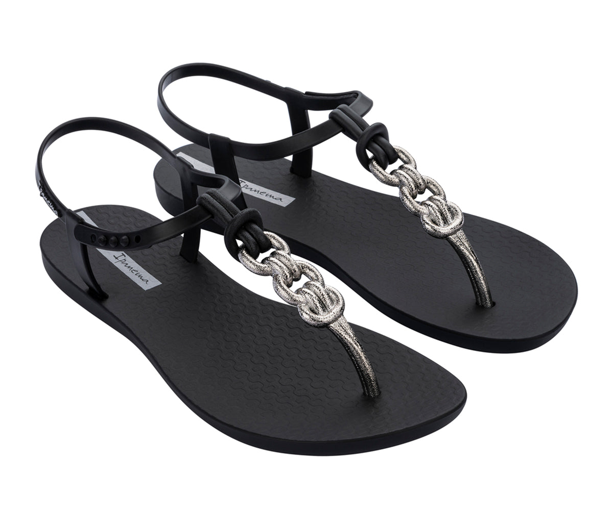 Angled view of a pair of black Ipanema Connect sandals with a silver chain-inspired T-strap.